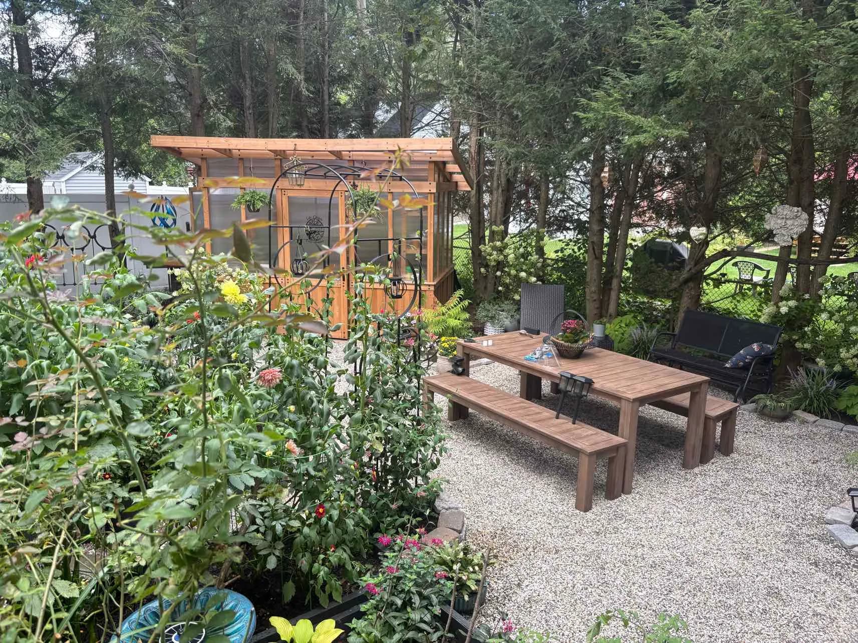 A long cedar table set in the garden