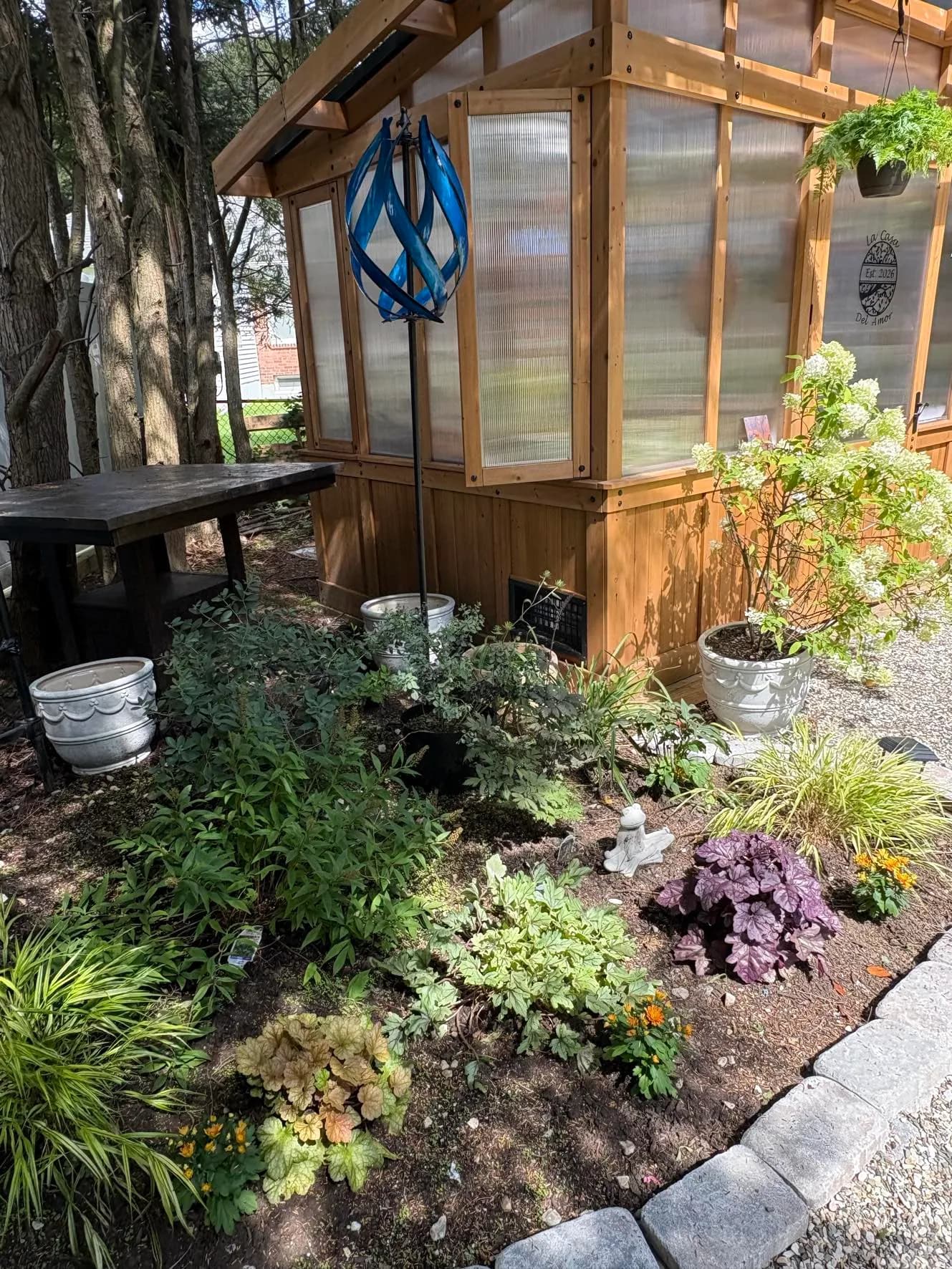 The shade garden beside the greenhouse
